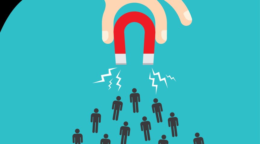 mão segurando um imã que atrai várias pessoas, demonstrando como funciona o outbound marketing