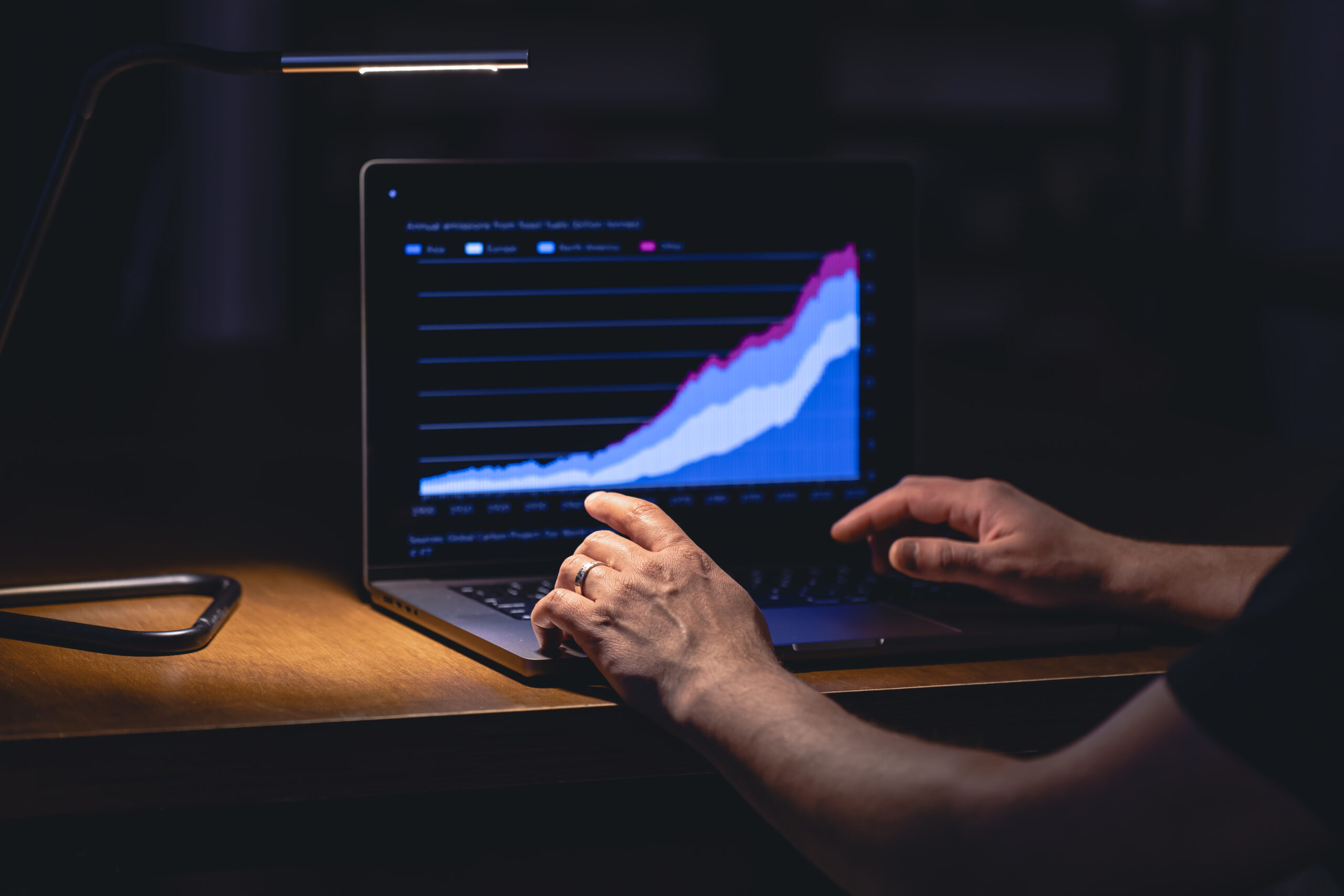 business man stock exchange trader looking laptop screen night scaled